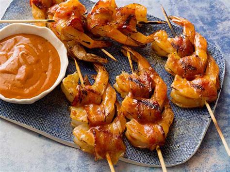 Shrimps appetizers make really good starters. Bacon-Wrapped Prawns with Chipotle BBQ Sauce Recipe | Guy Fieri | Food Network