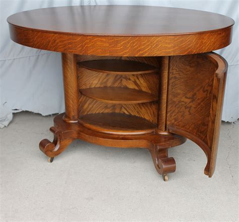 Kitchen and bathroom cabinets in st. Bargain John's Antiques | Antique Oak oval shaped Library Table with hidden concealed ...