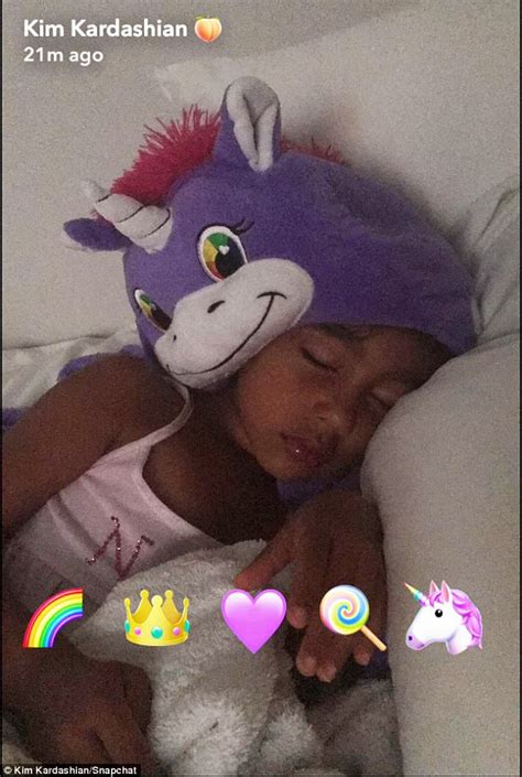 kim kardashian shares heartwarming photo of north west sleeping with a unicorn nightcap on her head