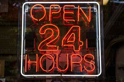Neon Sign Open 24 Hours Stock Photo