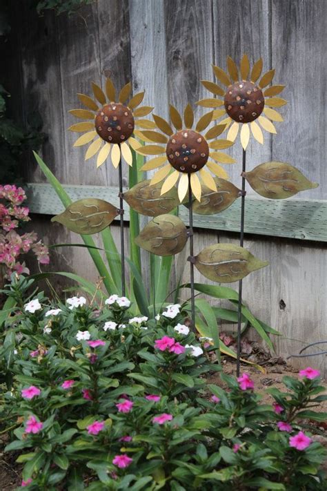These durable, sheet metal planters will compliment just about. Trio Of Metal Sunflowers Hand Made Decorative Garden Art ...