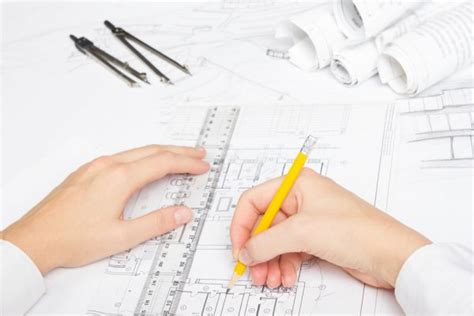 Architect Working On Blueprint Architects Workplace Architectural