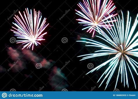 Colorful Fireworks In The Night Sky In The Form Of Flowers Stock Photo