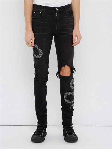 Amiri Denim Snake Embroidered Distressed Skinny Jeans In Black For Men