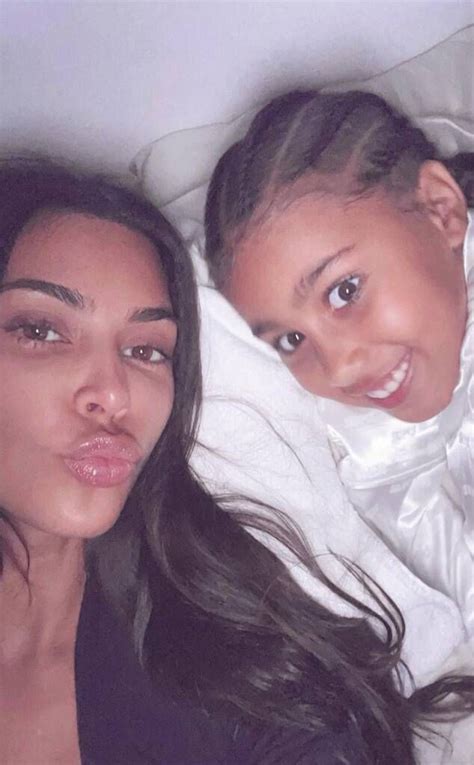 bedtime cuddles from kim kardashian and north west s cutest pics on e online kim kardashian and