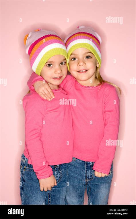 Young Female Twin Caucasian Children Standing Together Stock Photo Alamy