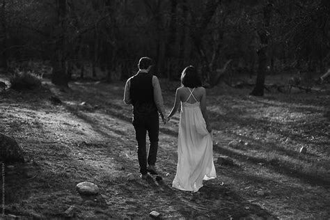 Couple Eloping In Yosemite Holding Hands And Exploring At Sunset By Stocksy Contributor Jess