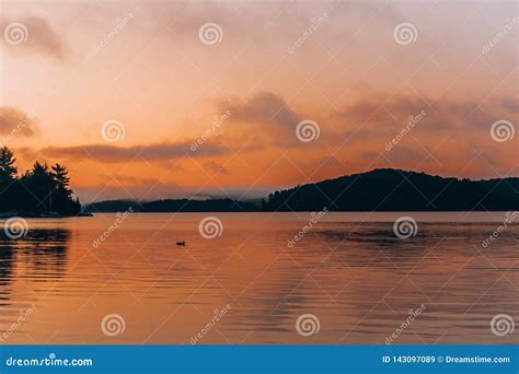A Still Lake During Sunset Stock Image Image Of Sunset 143097089