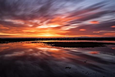 Colorful Sunset Reflected In The Water Stock Photo Image Of Twilight