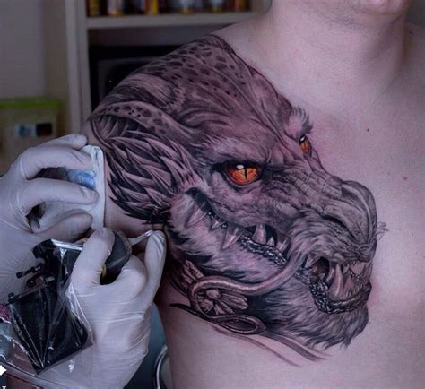 Realism Dragon Done In Bandg With Fiery Orange Eyes Tattooed By