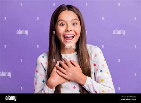 Photo Portrait Of Laughing Girl Touching Chest With Hands Isolated On