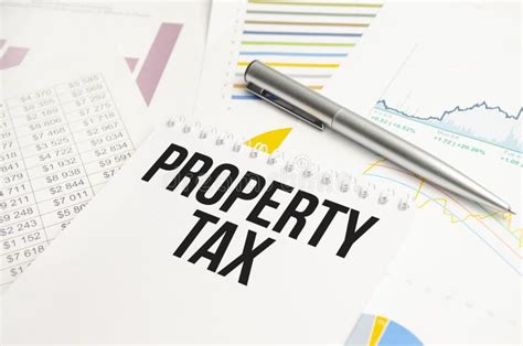 Text Property Tax On The White Paper On A Clipboard With Chart And