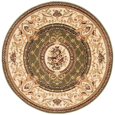 A Green And Beige Rug With An Ornate Design On The Center Surrounded