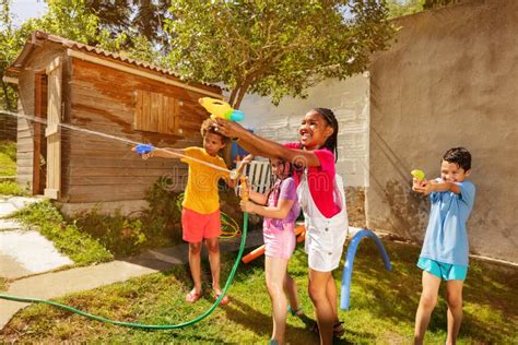 Happy Kids Play Water Gun Fight Game With Pistols Stock Image Image