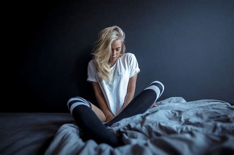 wallpaper women model blonde t shirt sitting in bed knee highs dark background