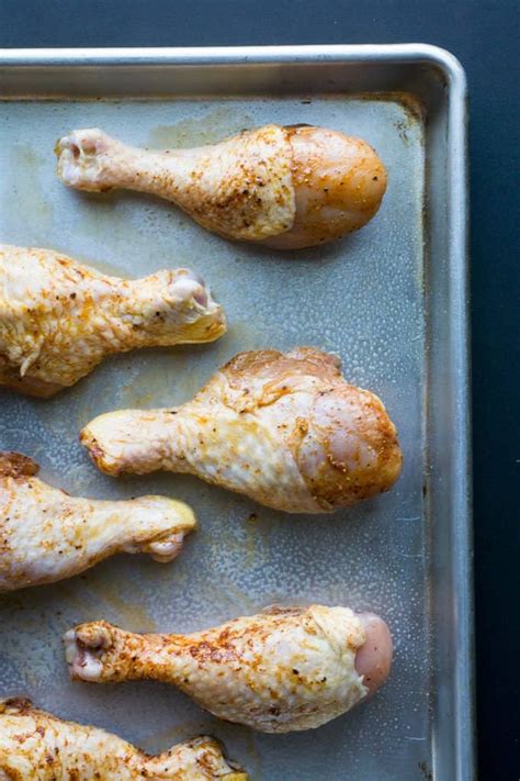 Place chicken legs in a large bowl and drizzle with olive oil, enough to cover them all, generously. Simple Baked Chicken Leg Drumsticks: easy chicken leg recipe
