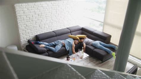 Drunk Friends Sleeping On Sofa In Messy Room Stock Footage Sbv 325592108 Storyblocks