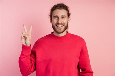 Premium Photo Guy Shows The V Sign The Sign Of Victory Peace