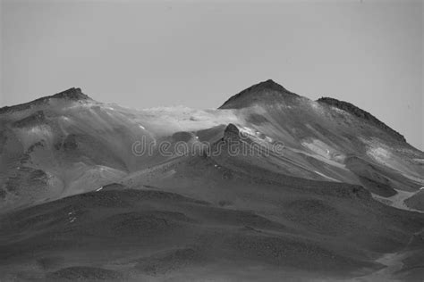 Grayscale Shot Of The Rocky Mountains In The Andes Range In Cordillera