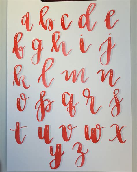 The Letters And Numbers Are Drawn In Red Ink On White Paper With A