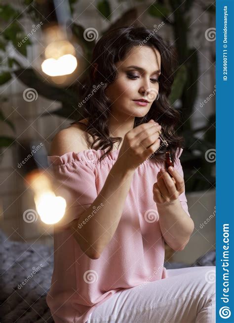 Woman With A Bottle Of Aromatic Oil Young Beautiful Brunette In A