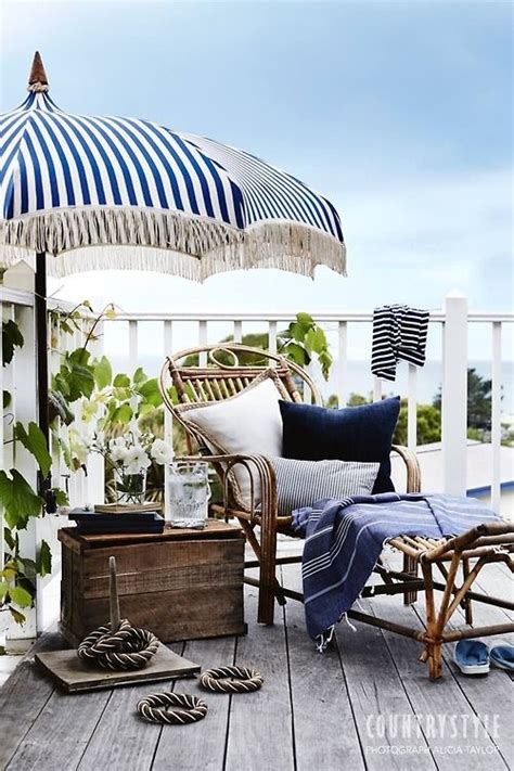 A Navy And White Striped Umbrella Rattan Chaise Old