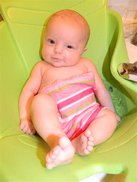 A 5.5 inch soft vinyl doll wearing a blue diaper; Polka-Dotty Place: Baby Bathtub