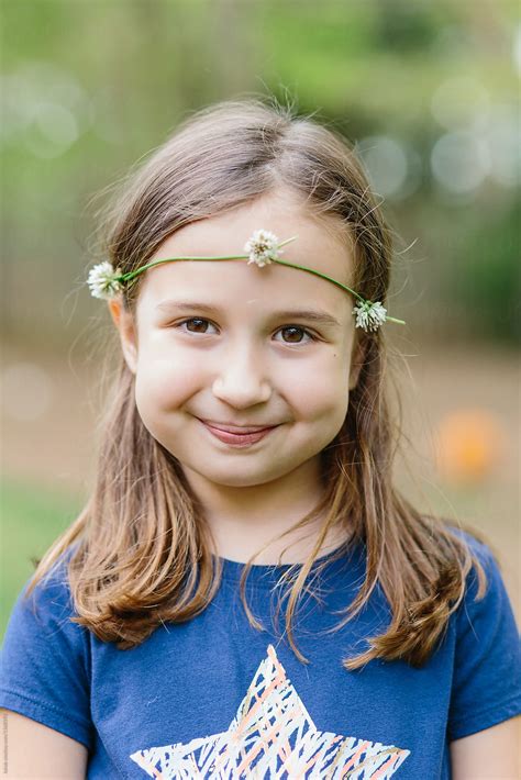 Cute Young Girl Wearing Headband Made Out Of White Clover Flower By