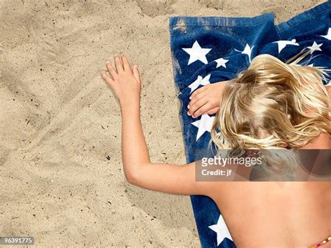 Girls Tanning On Beach Photos And Premium High Res Pictures Getty Images