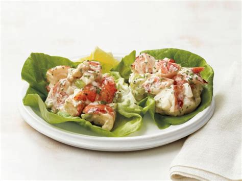 An elegant salad recipe of warm lobster tossed with tarragon butter and served over butter lettuce. Lobster Salad Recipe | Geoffrey Zakarian | Food Network