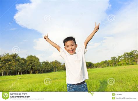 Happy Children Standing On Meadow And Raise Hands Stock Image Image