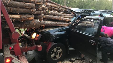 A Driver Is Rescued Alive After His Car Is Impaled By Logs From A Truck