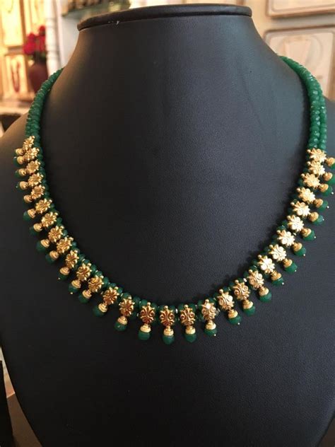 Latest beautiful black beads necklace designs in 5gms. ruby and emerald beads necklace design ...