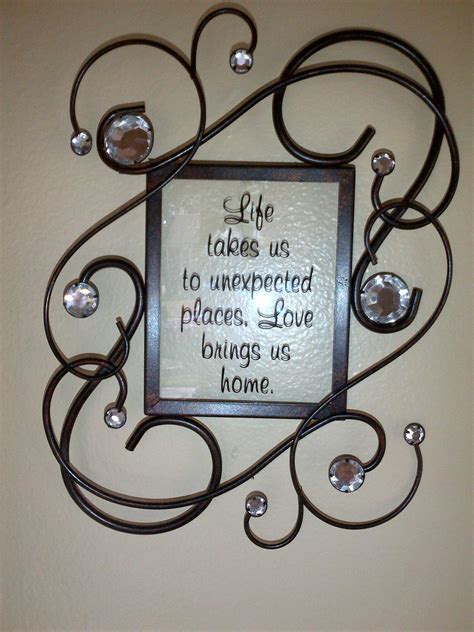 A Metal Frame With A Quote On It That Says Life Takes Us To Unnempted