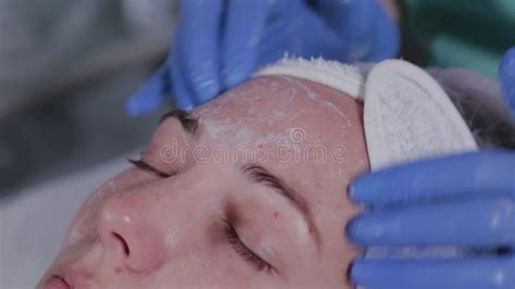 Professional Beautician Washes A Woman And Massages Her Face Stock