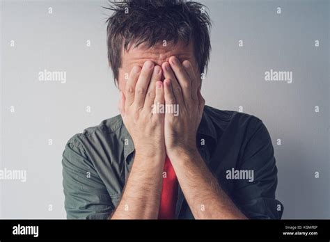 Disappointed Man Crying With Head In Hands Sad And Lonely Adult Male