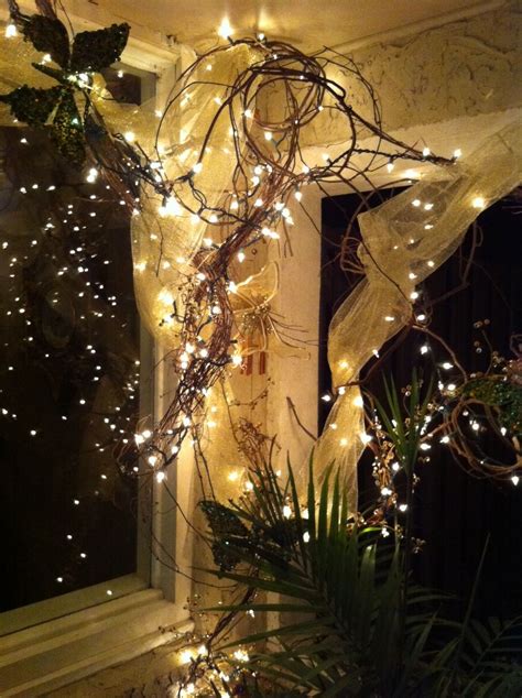 Grapevine Wrapped With White Lights And Toolfront Porch Sitting Area