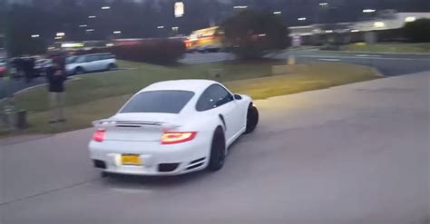 Porsche 911 Turbo Nearly Crashes While Leaving Car Meet Driver Saves