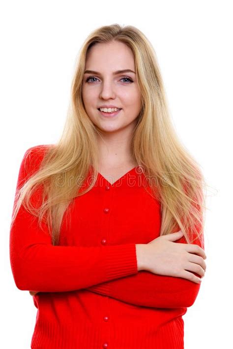 Studio Shot Of Young Happy Teenage Girl Smiling With Arms Crosse Stock