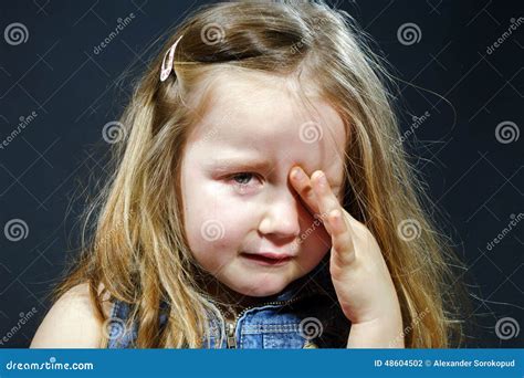 Crying Blond Little Girl With Focus On Her Tears Stock Image