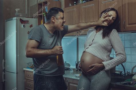 Drunk Man Hits A Pregnant Woman Stock Photo Kladyk