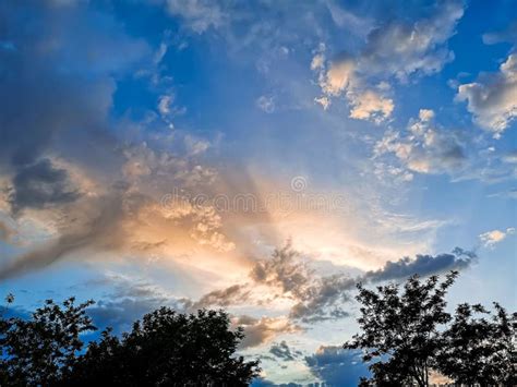 Spectacular Blue Sky With Mistic Clouds And Rays Of Lights Stock Image
