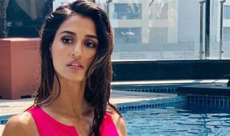 disha patani looks smoking hot in pink monokini as she strikes a sultry pose near the pool