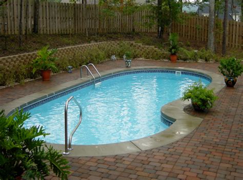 Northeast Inground Pool Featuring A Paver Deck And Cantilever Coping