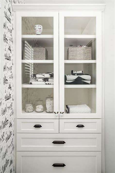 A bathroom mirror cabinet is a great choice for storage and grooming and can add the illusion of space to even the bathroom furniture cabinets bathroom furniture cabinets are a great way to bring personality and flair to your space when creating your dream. Built In Glass Front Linen Cabinet with Glass Shelves ...