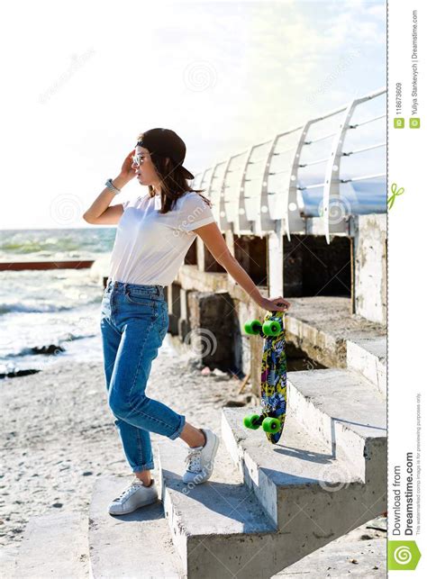 Woman With A Skateboard On A Beach Stock Image Image Of Brown