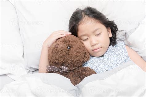 Cute Little Asian Girl Sleep And Hug Teddy Bear 22957130 Stock Photo At