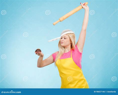 Woman Holding Cupcake Rolling Pin Wearing Colander On Head Stock Photo Image Of Kitchen