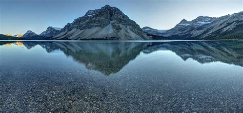 Reflection Of Mountains On Tranquil By Ascentxmedia