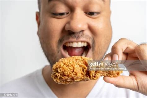 Fat Guy Eating Chicken Photos And Premium High Res Pictures Getty Images